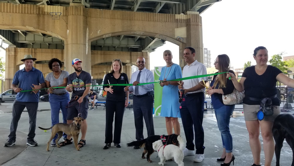 Ribbon cutting for new dog run and renovated basketball court under RFK Triborough Bridge